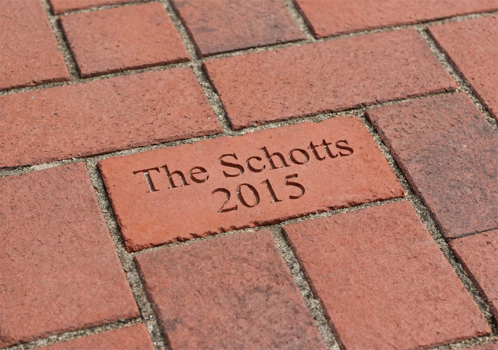 Engraved brick path with the Schotts name and date